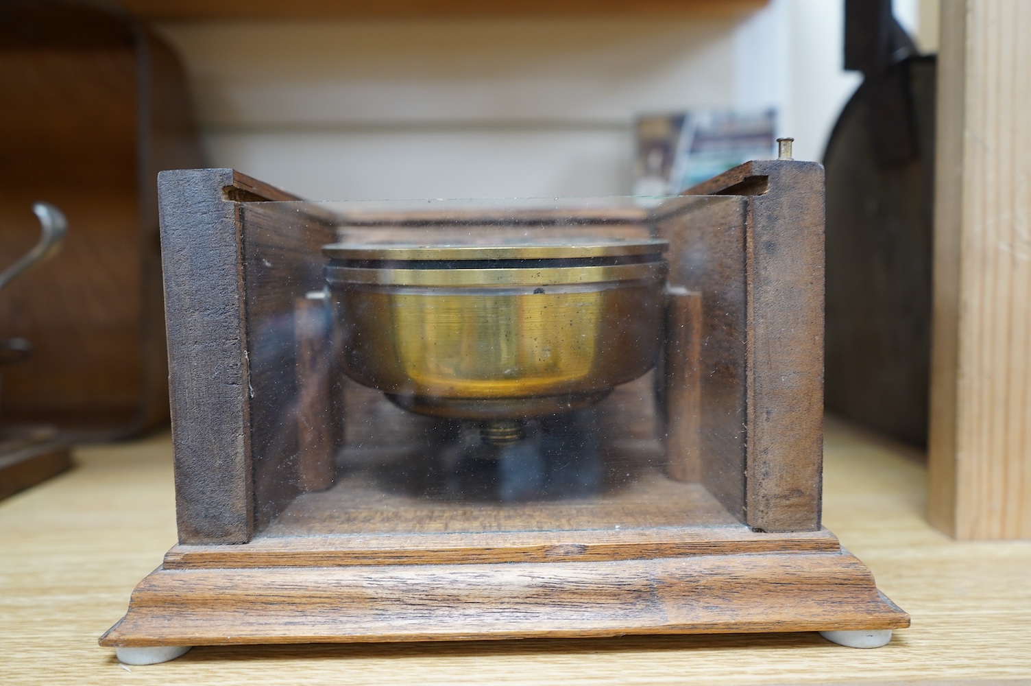 A ‘Kelvin & James White Ltd. 18 Cambridge St. Glasgow’ ship's compass, in a later oak case, 13cm high, 21cm wide, 19cm deep. Condition - poor to fair.